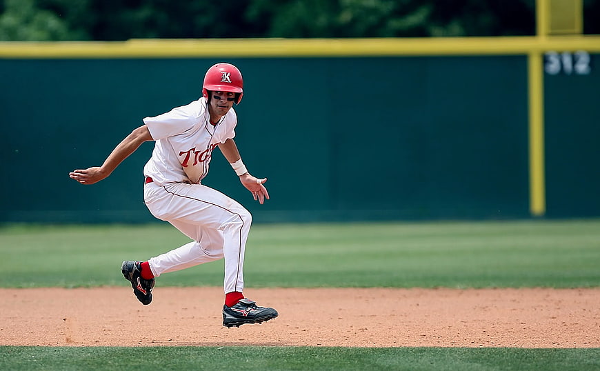 Baseball Player Running on Dirt Field