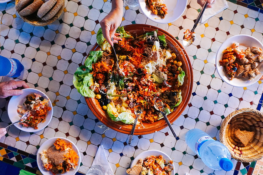 Overhead View of Shared Middle Eastern Meal on Mosaic Table