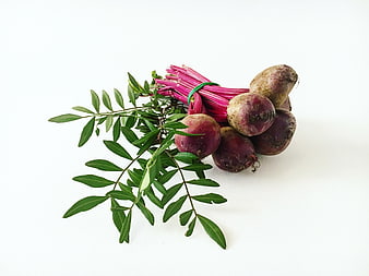 Fresh Beetroot with Green Leaves on White Background