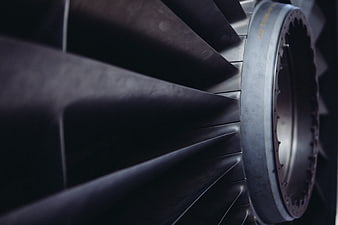 Close-up of dark metallic jet engine turbine blades
