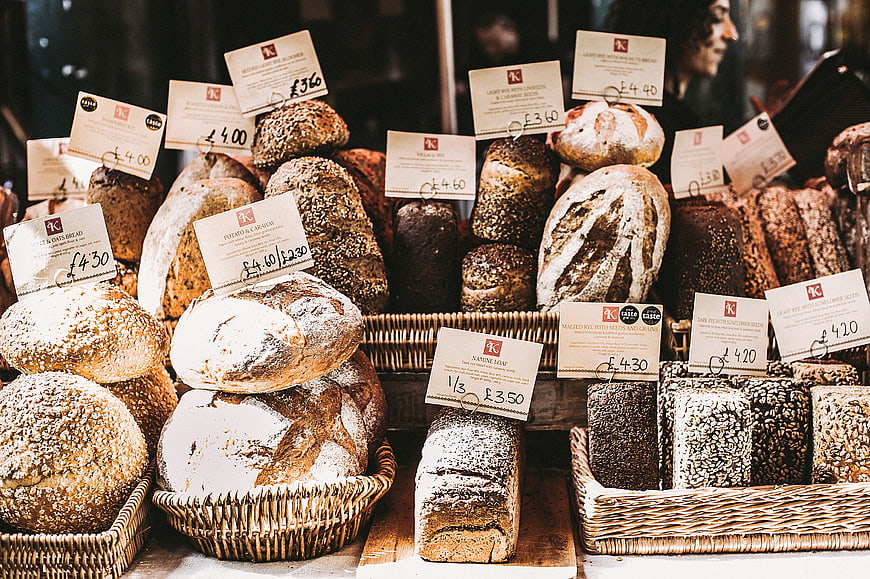 Artisanal Bread Display in Wicker Baskets at Bakery