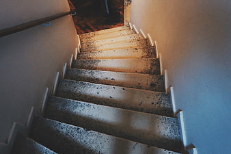 High Angle View of Worn Concrete Staircase with Blue and Orange Lighting