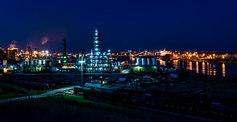 Illuminated Oil Refinery and Industrial Port at Night