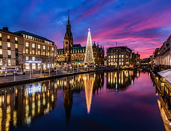 Hamburg Christmas Market at Dusk with Town Hall and Canal Reflections