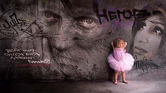 Little Girl in Pink Tutu Against Graffiti Wall