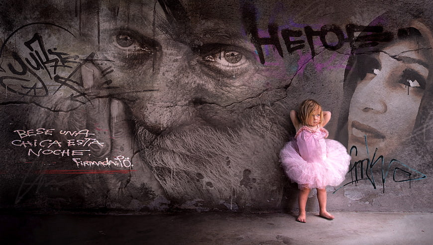 Little Girl in Pink Tutu Against Graffiti Wall