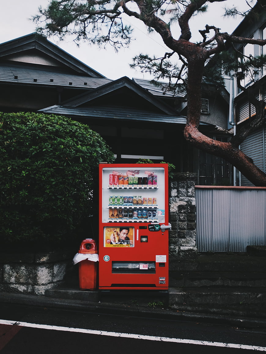 Red vending machine on quiet Japanese street