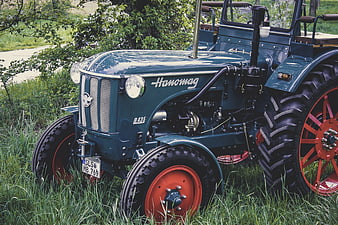 Vintage Hanomag R435 Tractor Parked In Green Grass