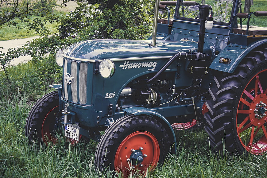 Vintage Hanomag R435 Tractor Parked In Green Grass