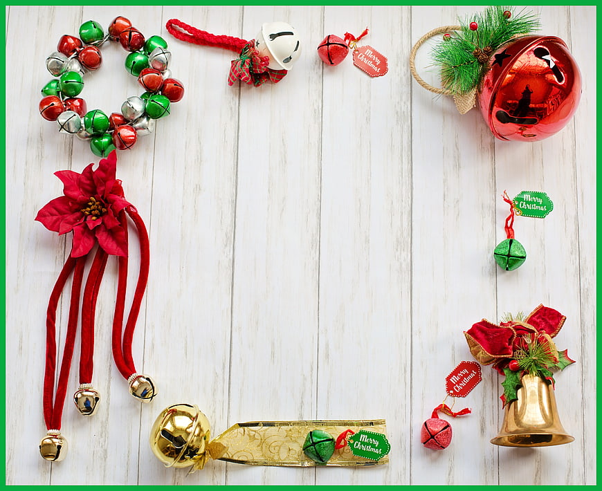 Christmas Holiday Frame With Bells, Poinsettia, and Ornaments On White Wood