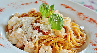 Shrimp Spaghetti Pasta With Parmesan Cheese And Fresh Basil Garnish