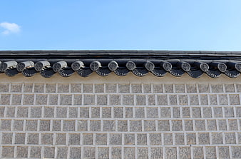 Traditional Korean Roof Tiles And Stone Wall Detail