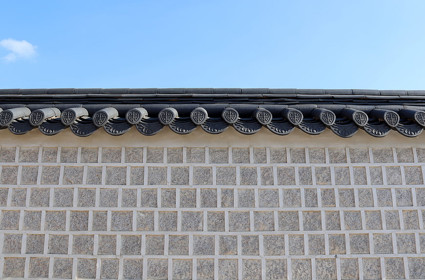 Traditional Korean Roof Tiles And Stone Wall Detail