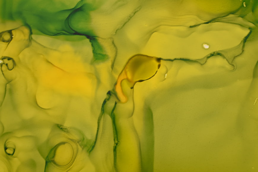 Abstract Green and Yellow Ink Fluid Art Background