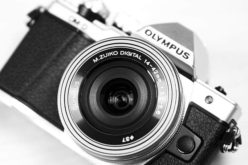 Black and White Close-Up of Vintage Olympus Camera Lens