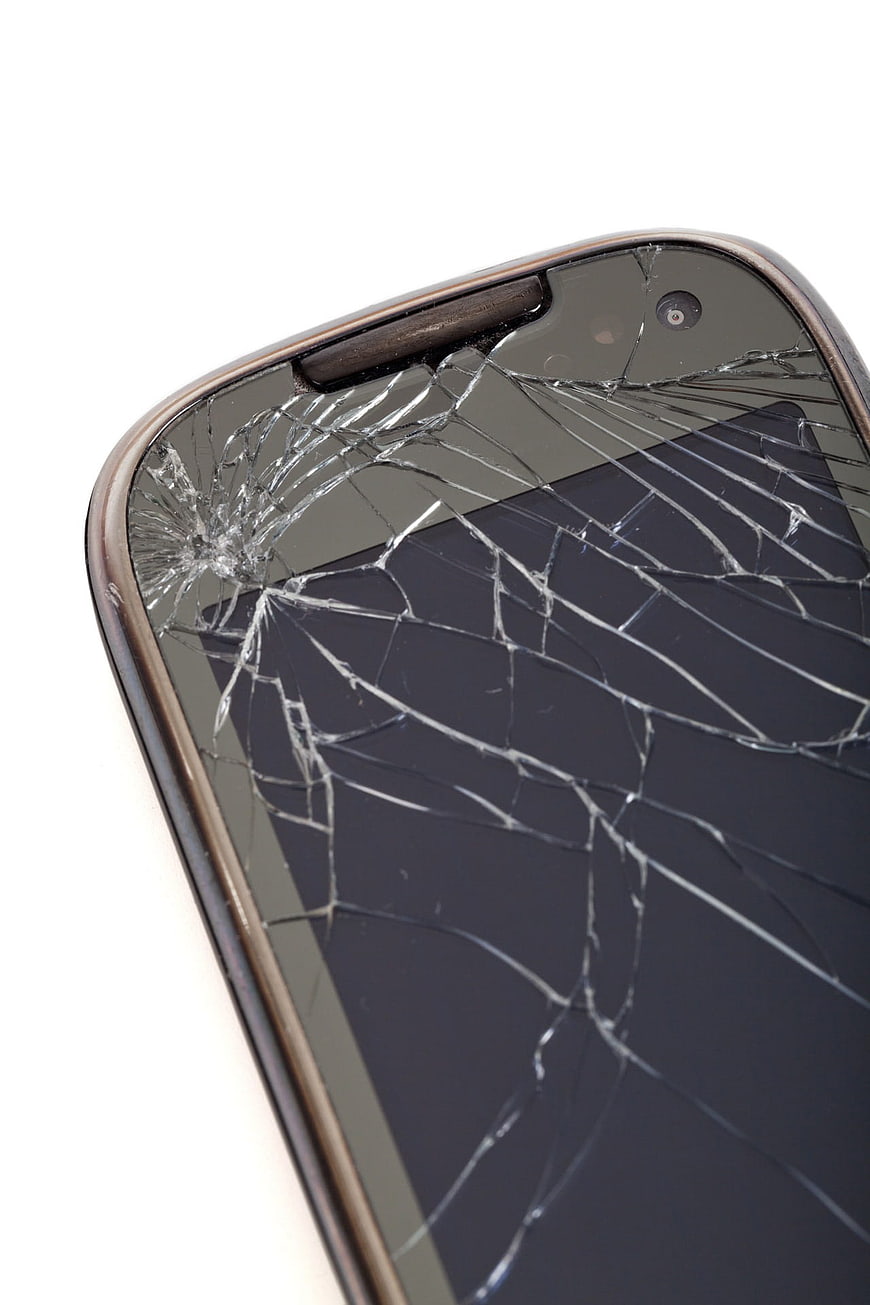 Close-up of a Smartphone with a Shattered Screen