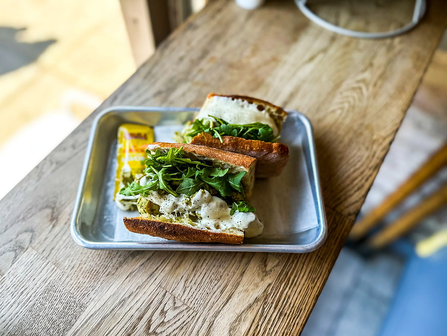 Fresh Arugula Sandwich on Metal Tray at Cafe