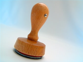 Wooden Rubber Stamp On Light Blue Background
