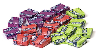 Assorted Wrapped Chewing Gum Pieces On White Background