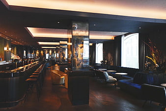 Luxury Dark Bar Interior With Modern Seating And Ambient Lighting