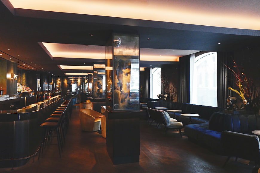 Luxury Dark Bar Interior With Modern Seating And Ambient Lighting