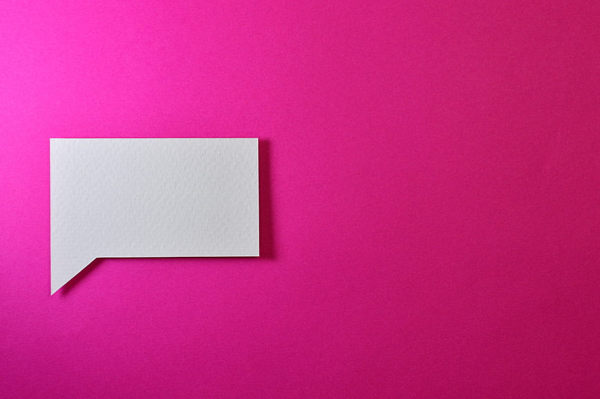White speech bubble on vibrant pink background
