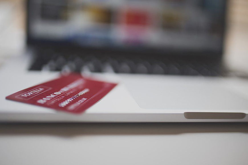 Red Credit Card on Laptop for Online Banking