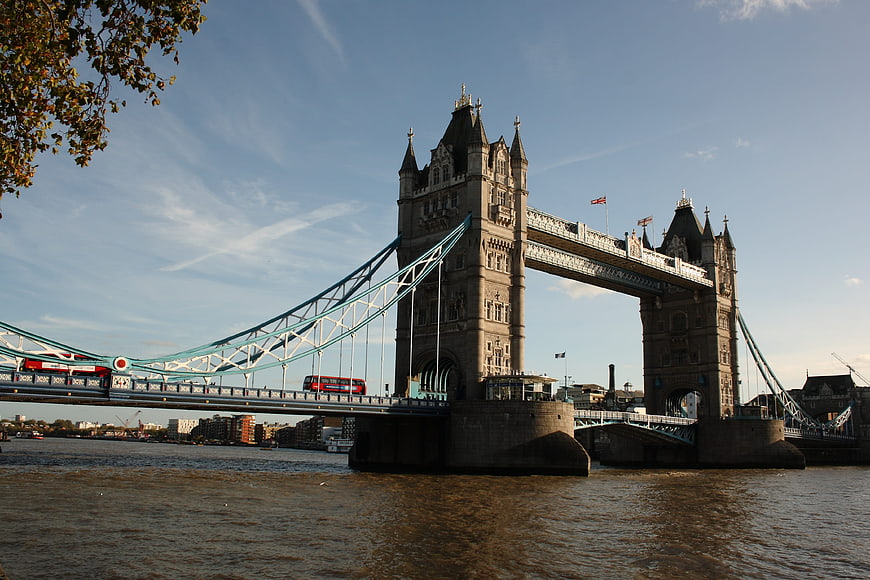 Tower Bridge London with Red Double Decker Bus on River Thames