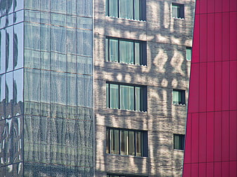 Modern Architecture Facade with Glass, Brick, and Red Panels