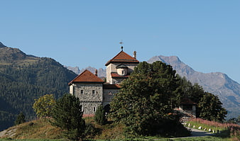 Castello Crap da Sass in the Swiss Alps with mountain backdrop