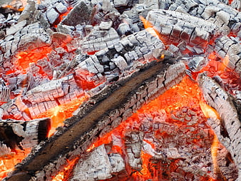 Close-up of burning charcoal and glowing red embers