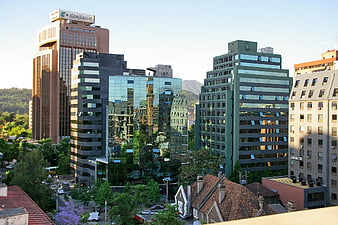 Modern city skyline with office buildings and greenery