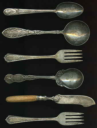 Vintage Silver Cutlery Collection on Black Background