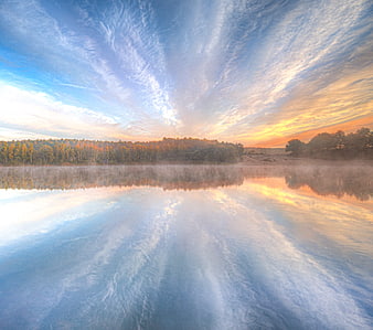Serene Lake Sunrise with Misty Forest Reflection