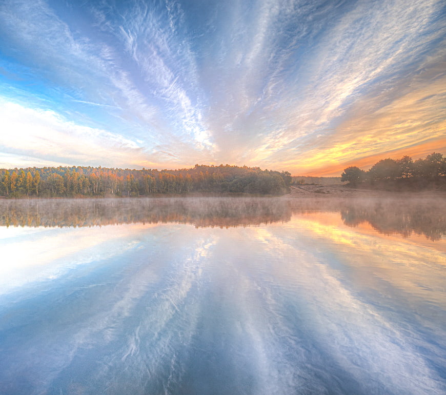 Serene Lake Sunrise with Misty Forest Reflection
