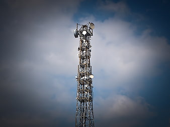 Telecommunications Tower Against Dramatic Cloudy Sky