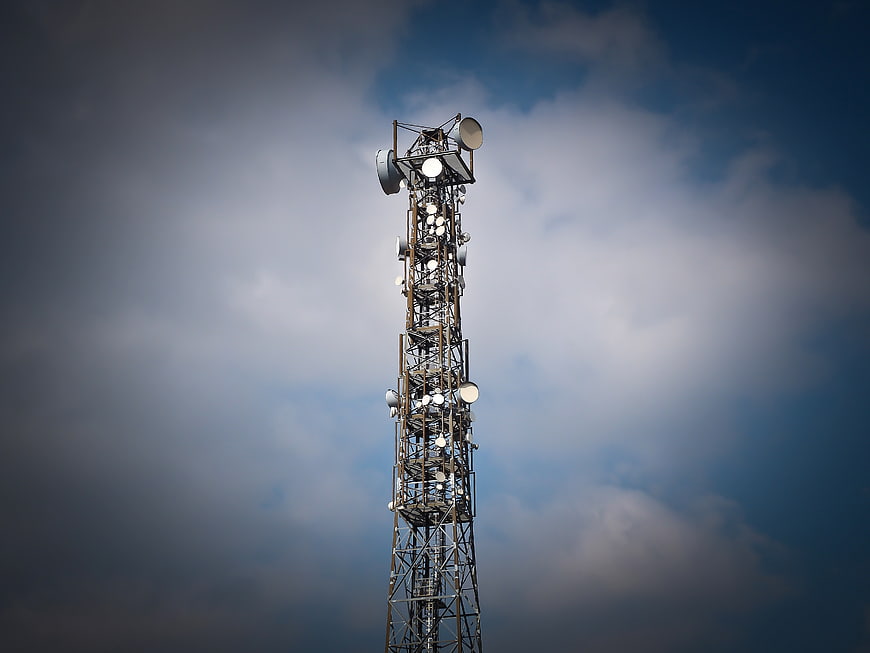 Telecommunications Tower Against Dramatic Cloudy Sky