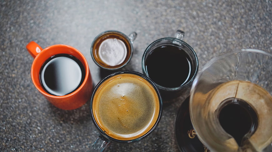 Top View of Various Coffee Cups and Pour Over Brewer