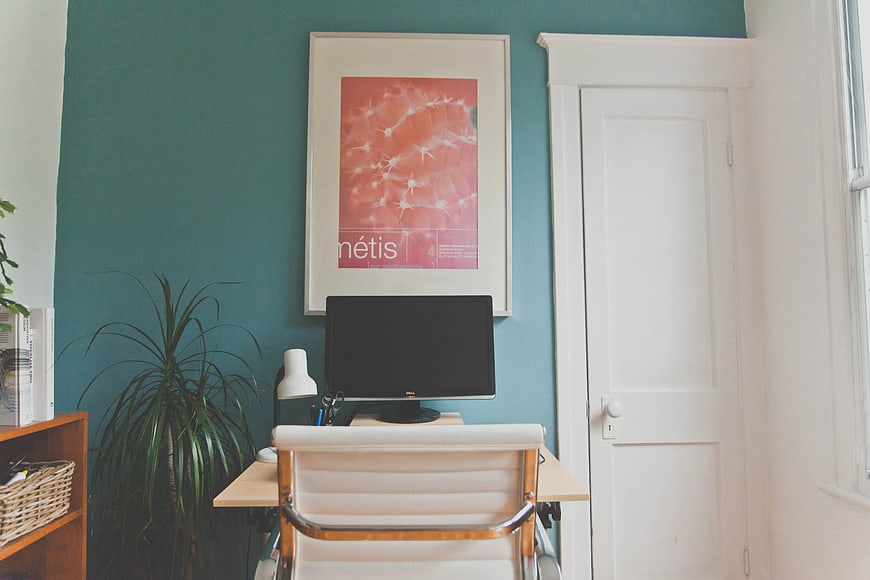 Modern Home Office Workspace with Teal Wall