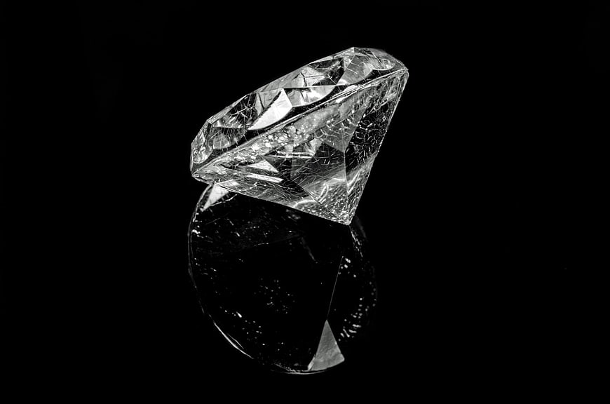 Black and white diamond on black background