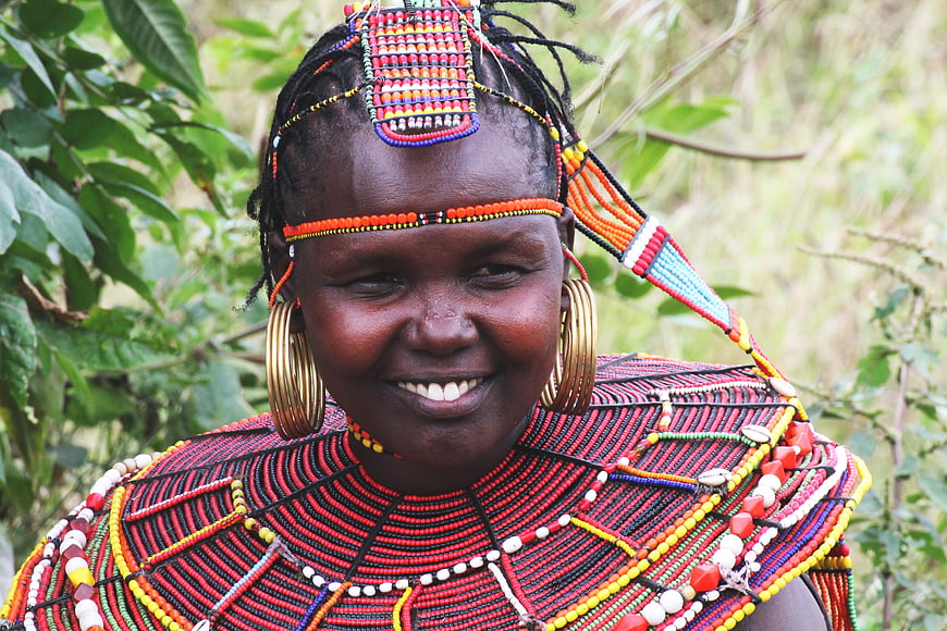 Portrait of smiling African woman in traditional Maasai beadwork