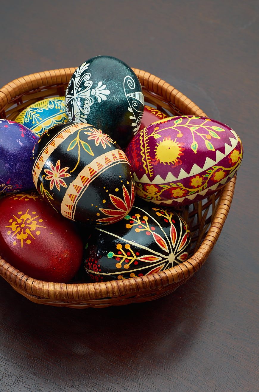 Colorful Hand-Painted Easter Eggs in Wicker Basket