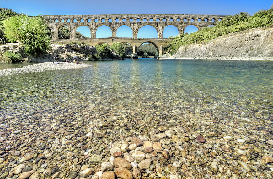 Pont du Gard aqueduct over clear river water