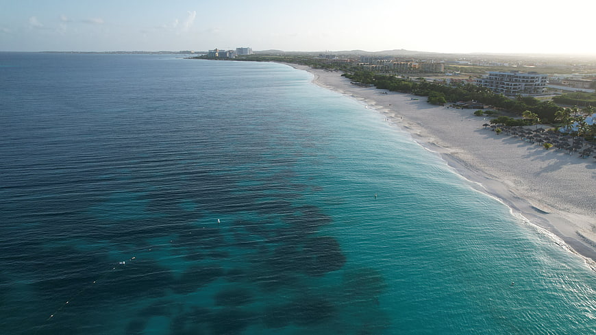 Aerial View of Turquoise Caribbean Coastline and Resort Beach