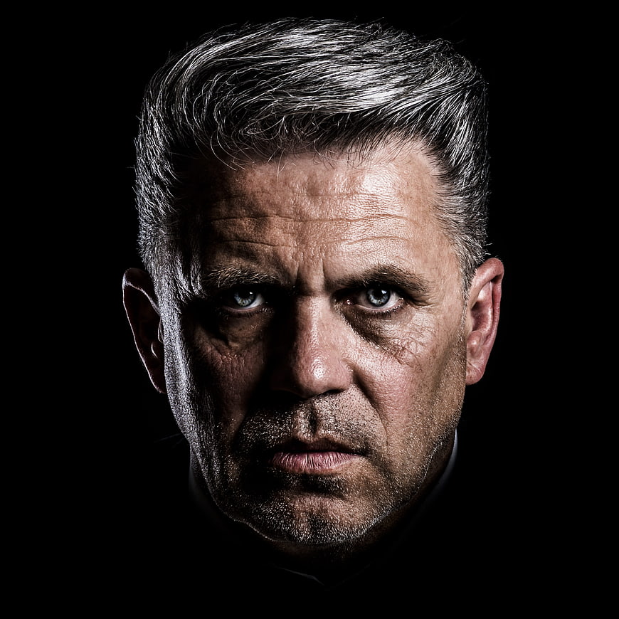 Intense close-up portrait of serious middle-aged man