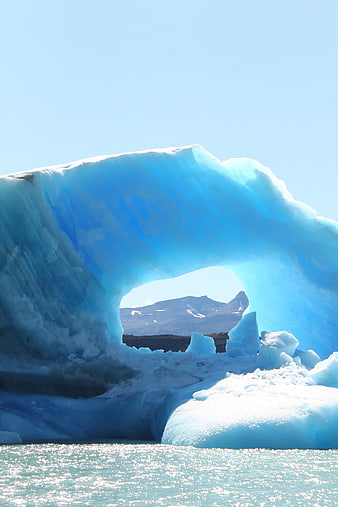 Blue Iceberg Arch in Glacial Water