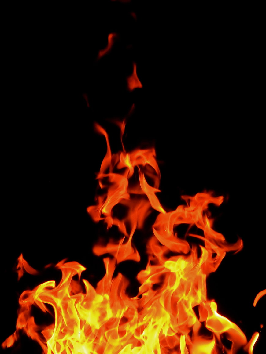 Vibrant Orange and Yellow Flames Against Black Background