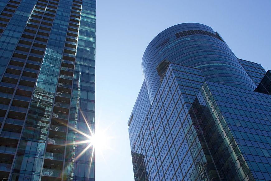 Modern Glass Skyscrapers with Sun Flare