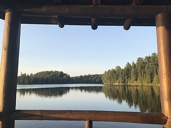 Serene Lake View Framed by Wooden Dock Structure