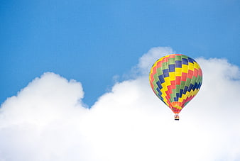 Colorful Hot Air Balloon Flying in Blue Sky